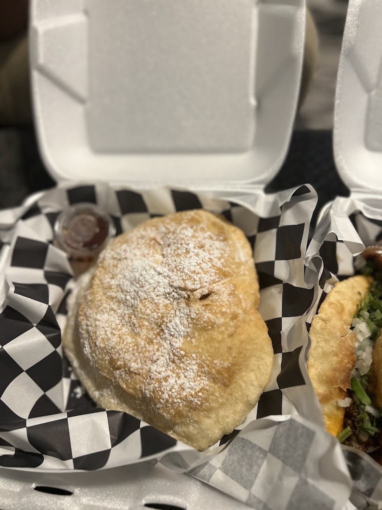 Sweet fry bread dusted with powdered sugar
