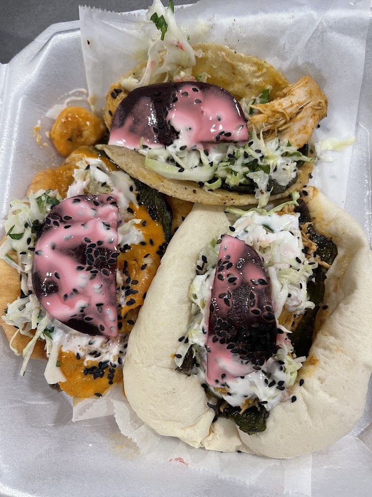 Chicken tacos and gorditas topped with slaw, pickled beets and crema